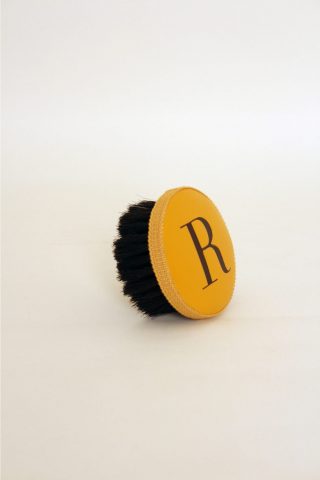 Brush with embossed letter R