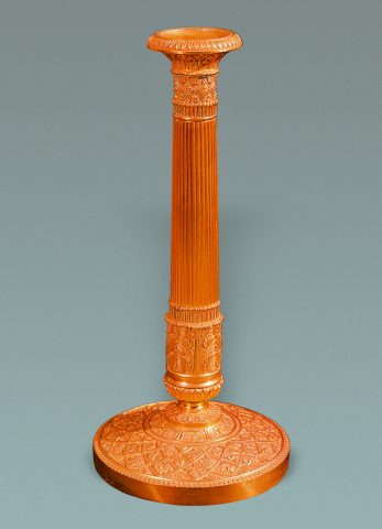 Chiselled bronze and gilded candlestick
